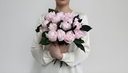 a mothers holding nordblooms preserved peonies arrangement