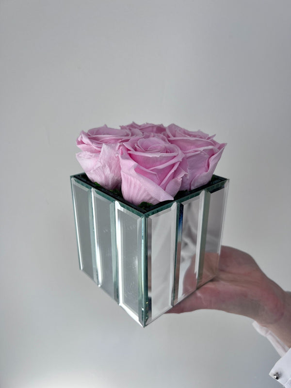 The Mirror Rose small arrangement of taffy pink preserved roses in a mirrored cube vase