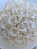 Close-up of the cream white preserved rose heads in the Amelie arrangement