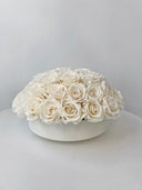 Amelie preserved rose bowl arrangement standing on a white table