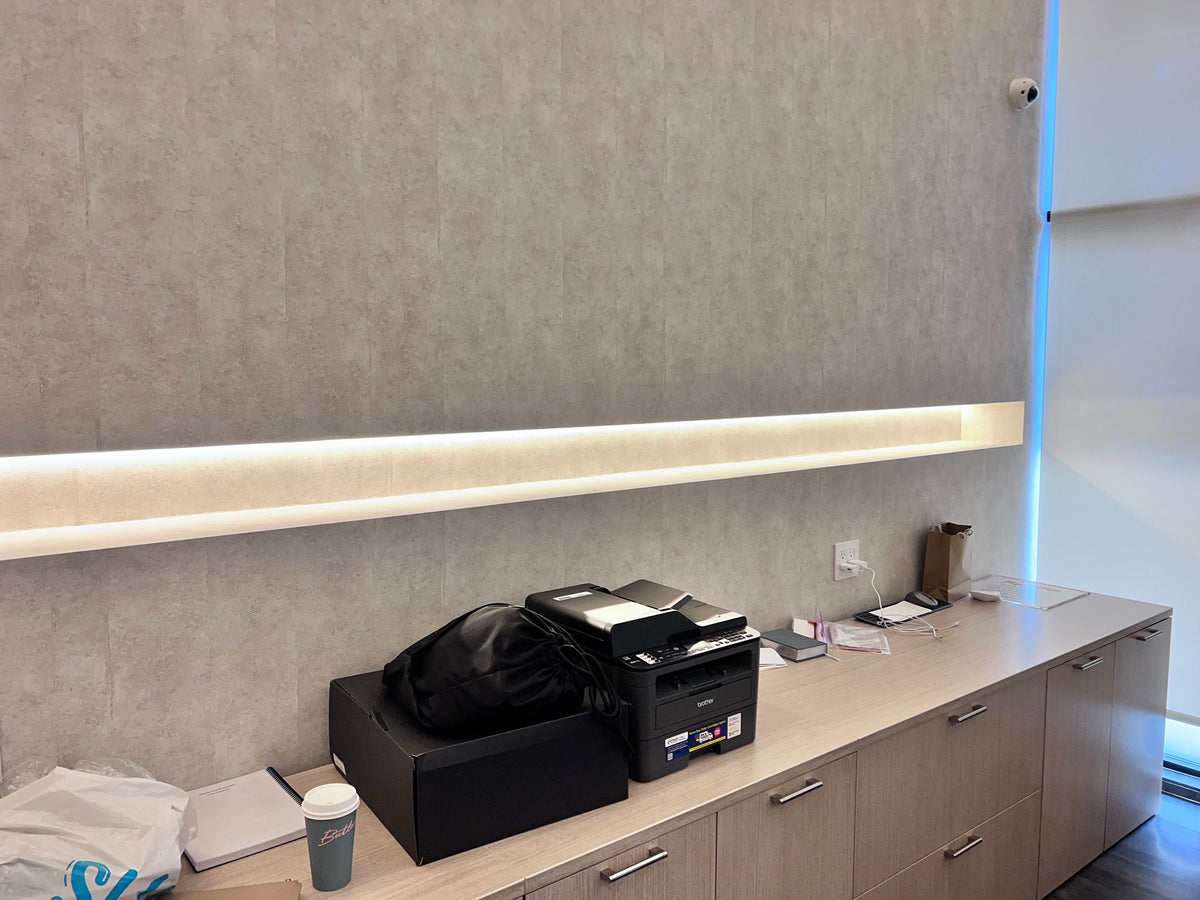 Before: the empty lit wall channel in an Energy Plus private office