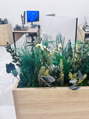 Close-up of preserved grasses, eucalyptus and cream blooms in an Energy Plus planter box
