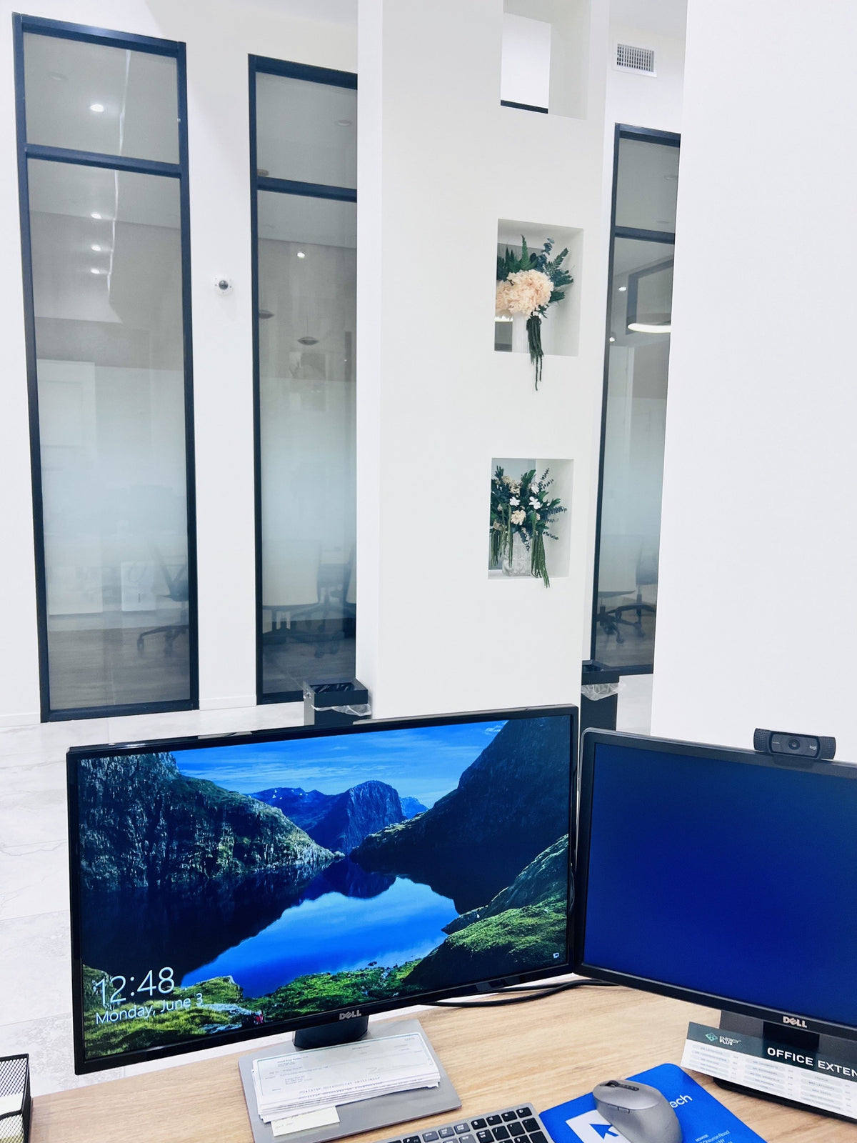Wall-niche florals above a workstation at Energy Plus