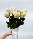 Long-stem cream preserved roses in a ribbed white vase