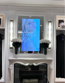 White preserved florals in silver vases on a fireplace mantel in a Ralph Lauren boutique