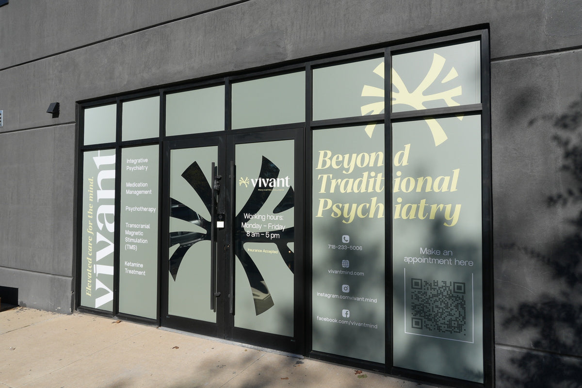 The Vivant Mind storefront in Greenpoint, Brooklyn, its glass printed with Beyond Traditional Psychiatry