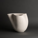 Xanadu Vase shown with other vases